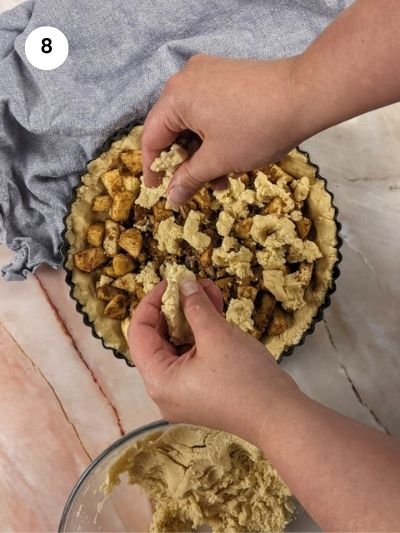 Sprinkling the top as a crumble to cover the apple filling.