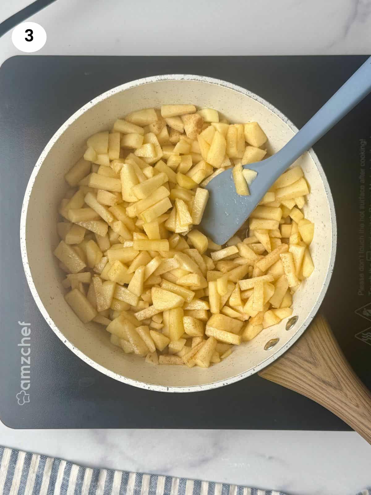 Chopped apples cooked in the pot.