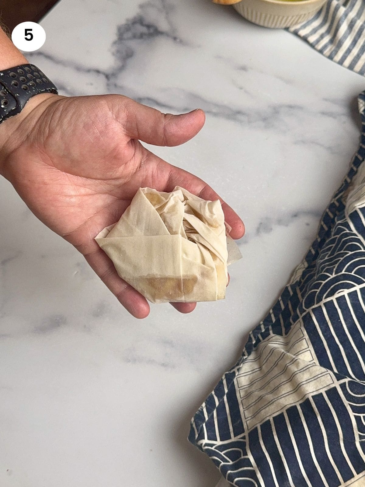 Folded phyllo pastry on my hand.