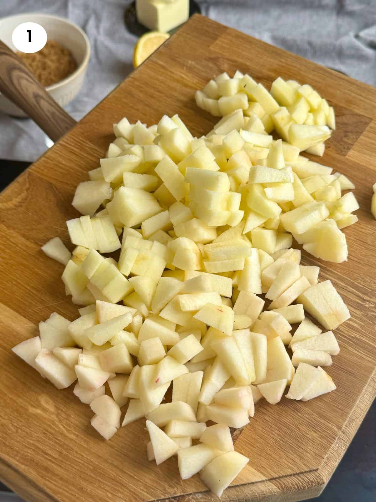 Chopped apples on a wooden board.