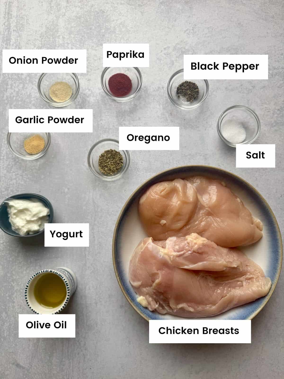Ingredients for baked chicken breasts with rubbed spices.