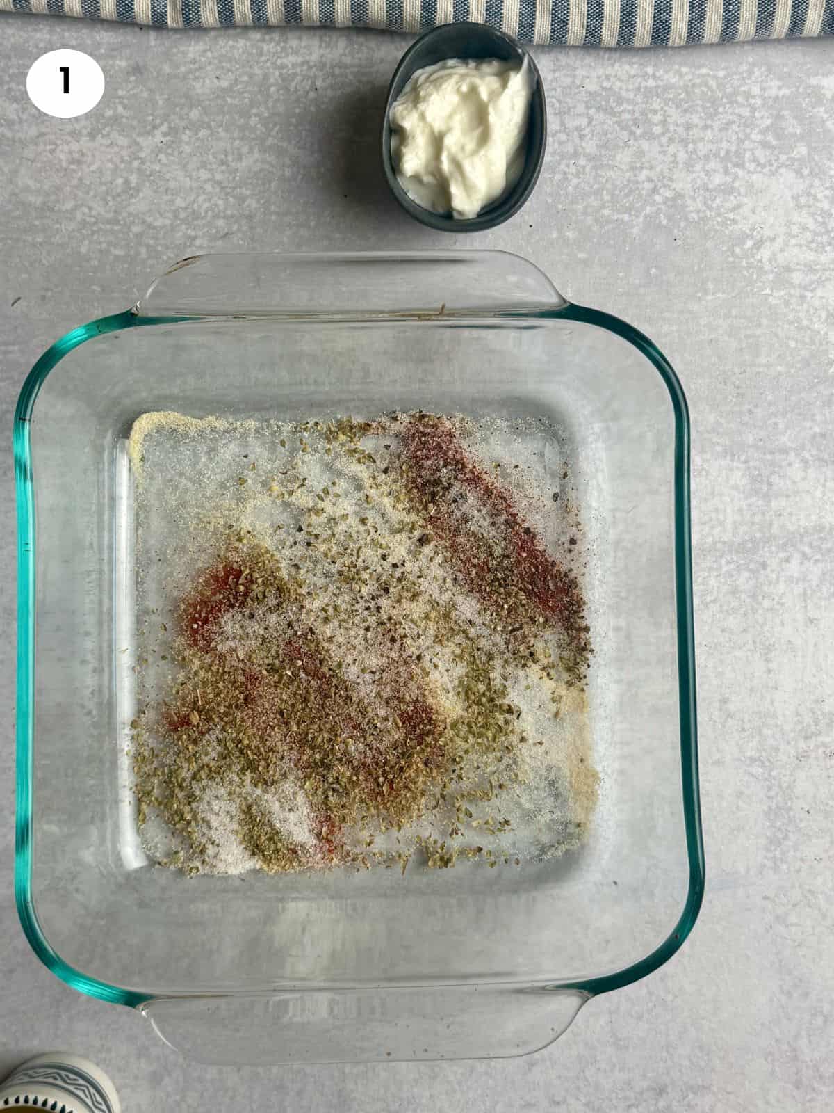 Mixing the dried herbs and spices.