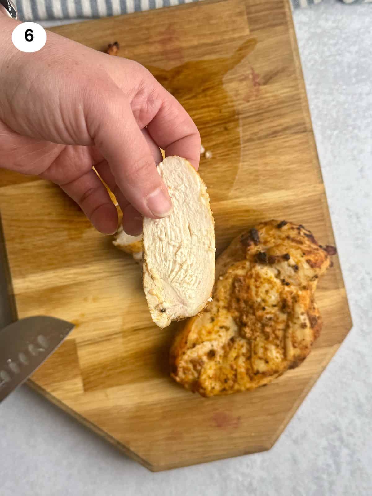 Showing a slice of baked chicken.