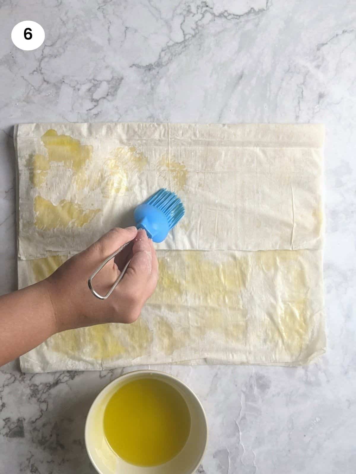 Brushing with oil the folded side.