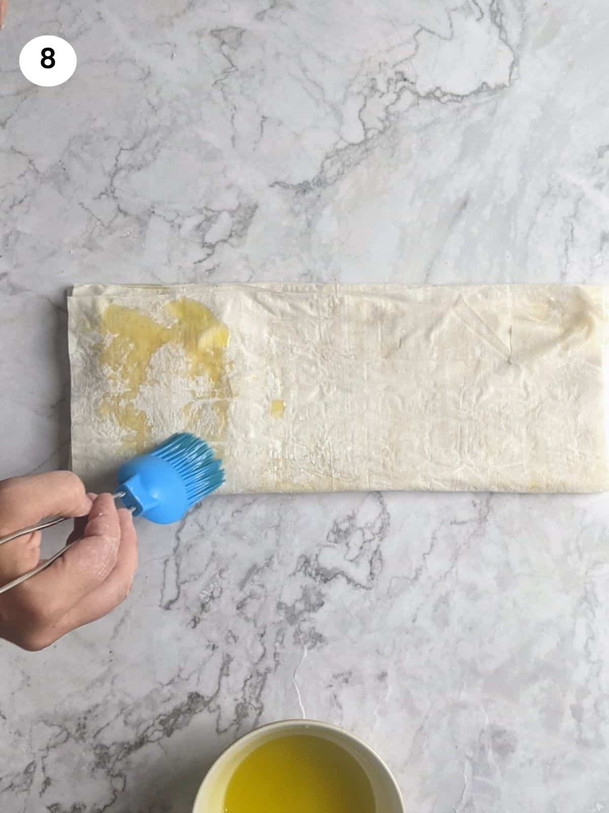 Brushing with oil only the phyllo on top of the feta.