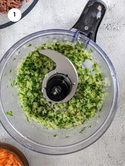 Blending the onion and parsley in the food processor.