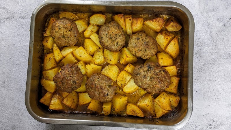Meatballs and potatoes when they come out of the oven.