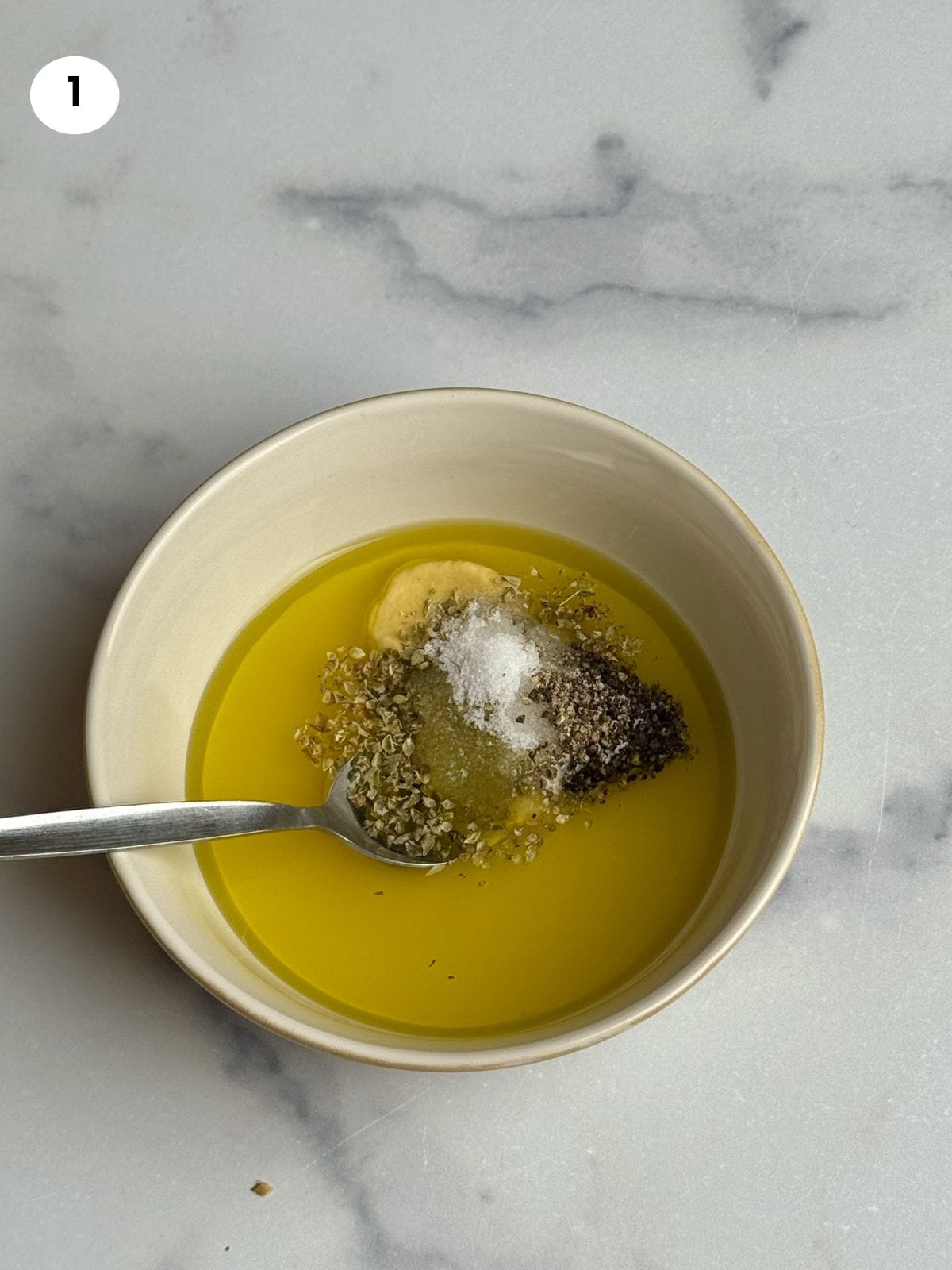 Adding the ingredients for the marinade to a bowl.
