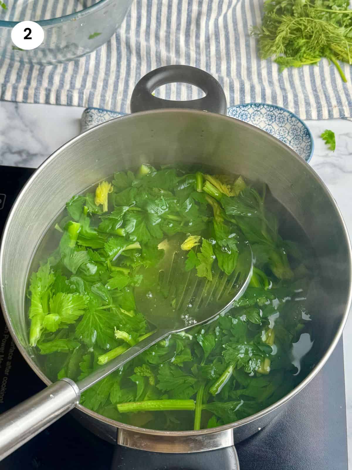 Blanching the celery greens.