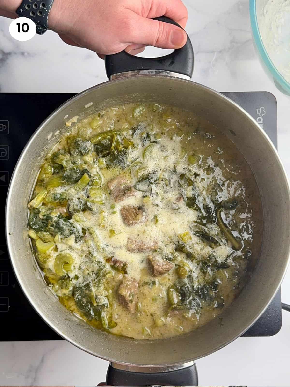 Avgolemono back to the pot with the stew.