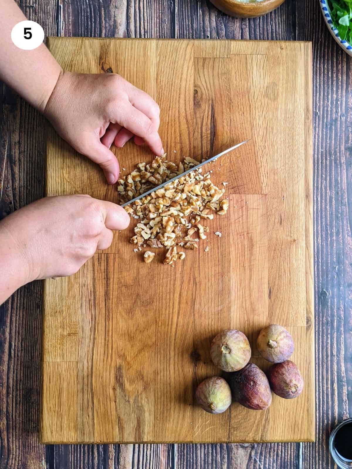 Chopping the walnuts coarsely.