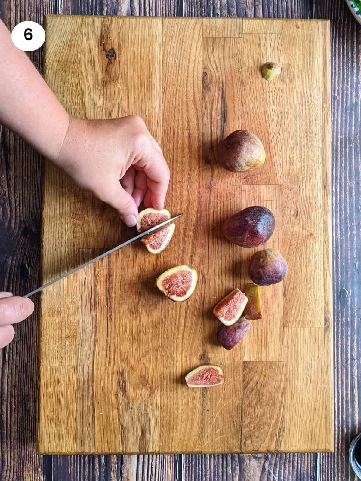 Cutting the figs into quarters.