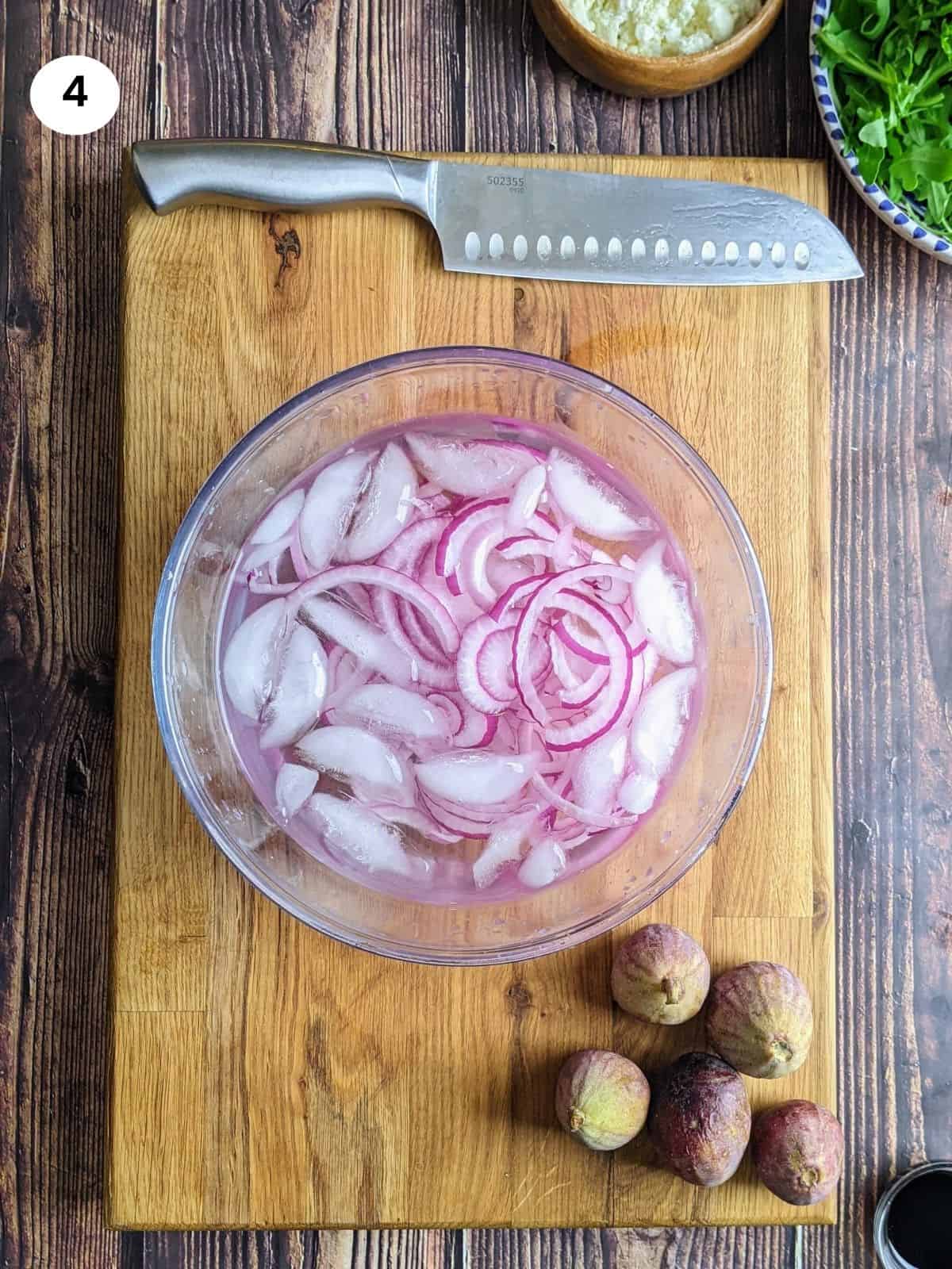 Onion slices in icy water.
