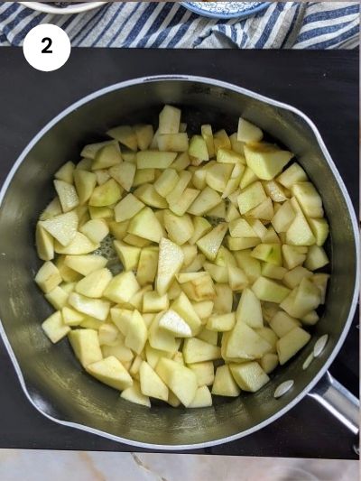 Cooking the apples for a few minutes.