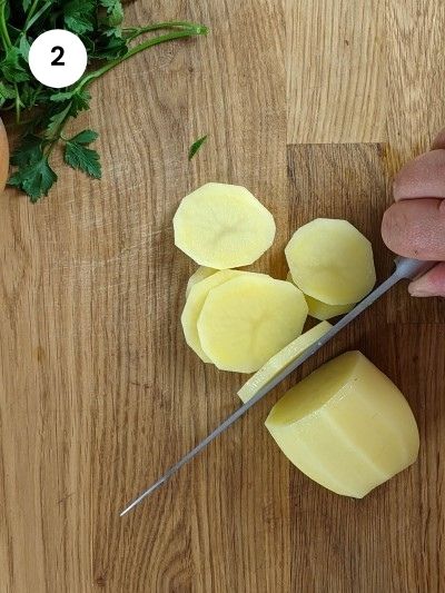 Slicing the potatoes for the boureki casserole.