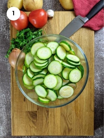 Slicing the zucchinis for the boureki casserole.