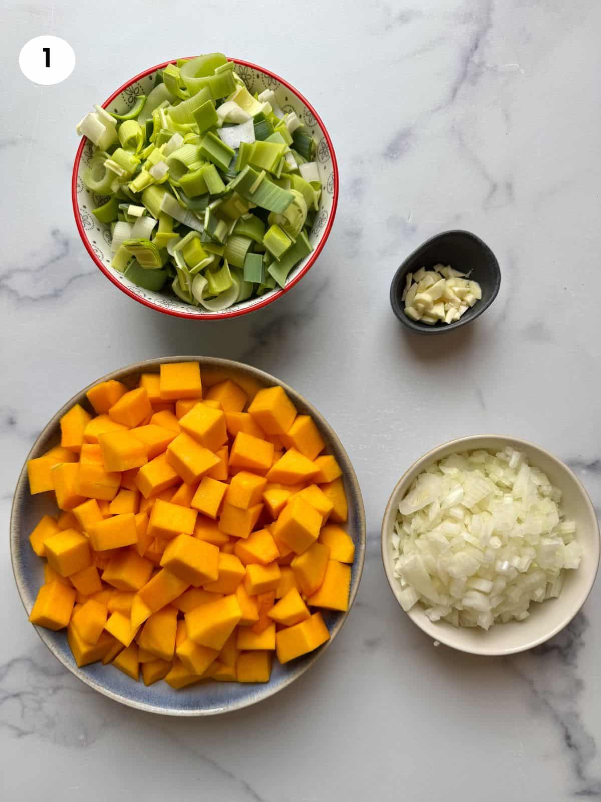 Chopped veggies into individual bowls.