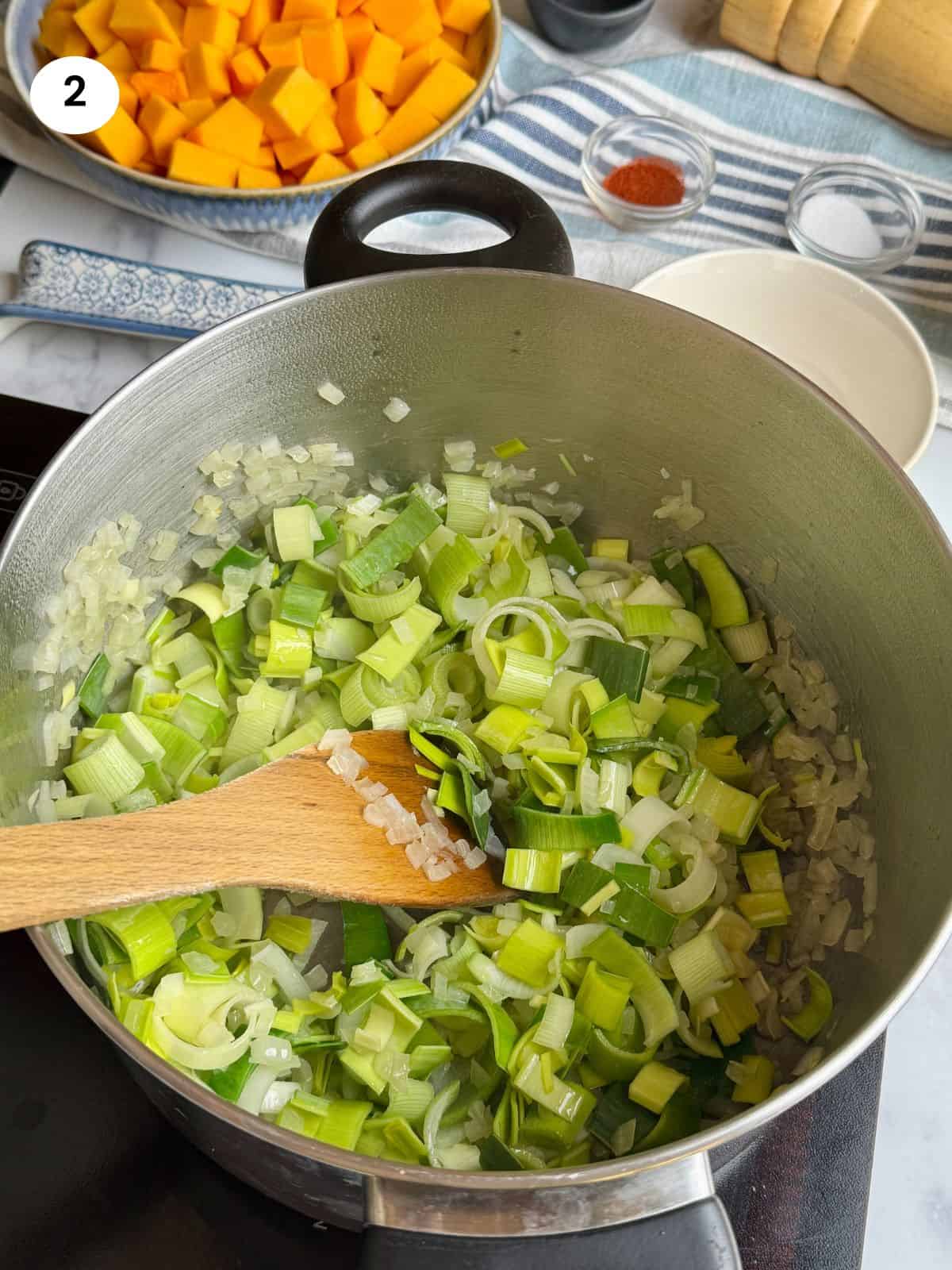 Cooking the chopped leeks.