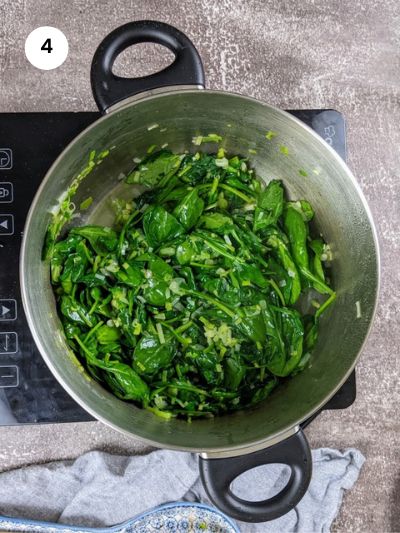 Wilted spinach in the pot.