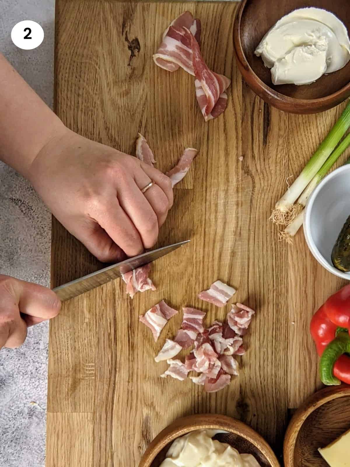 Cutting the bacon rashers into small pieces for the cauliflower salad.