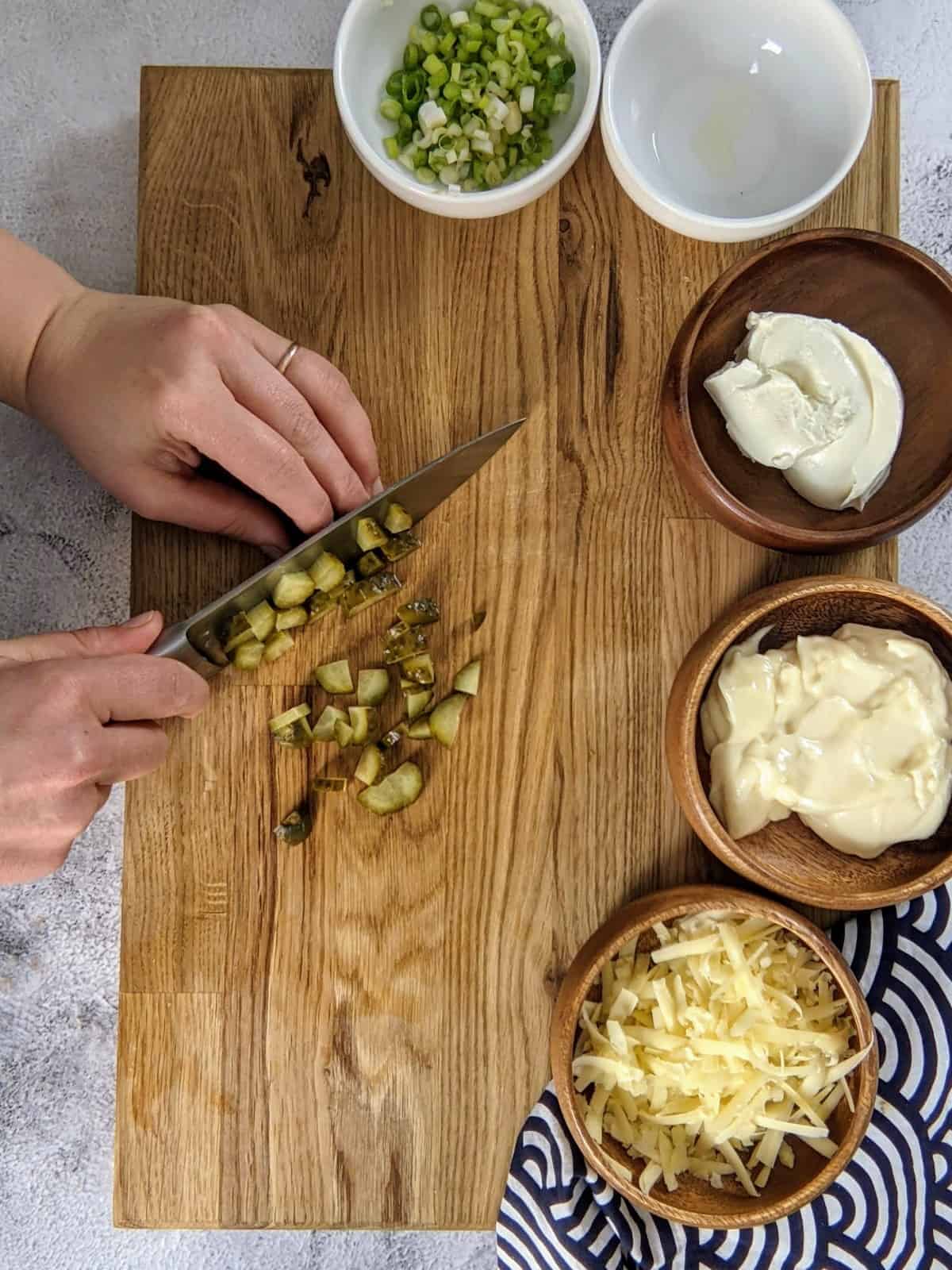 Cutting the pickled cucumber into cubes.