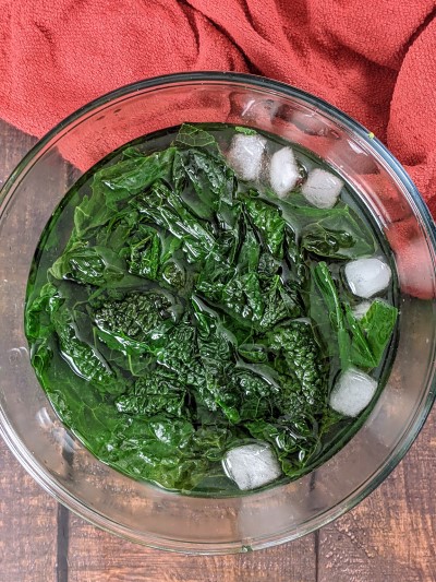 Boiled cavolo nero in cold icy water