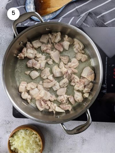 Cooking the chicken before adding the veggies.