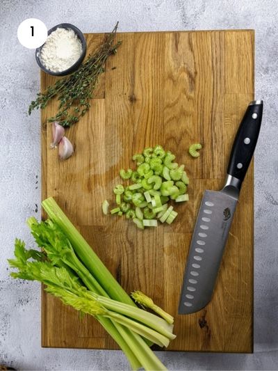 Cutting the celery stalks into slices for the celery, chicken and mushroom pie.