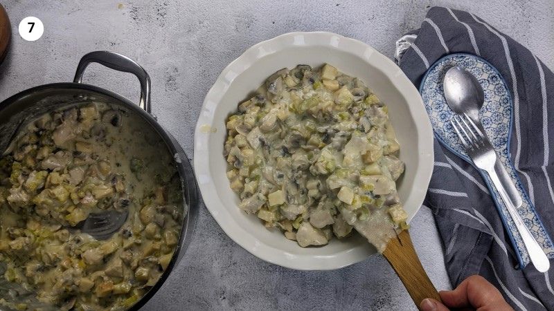 Adding the filling to the pie dish.