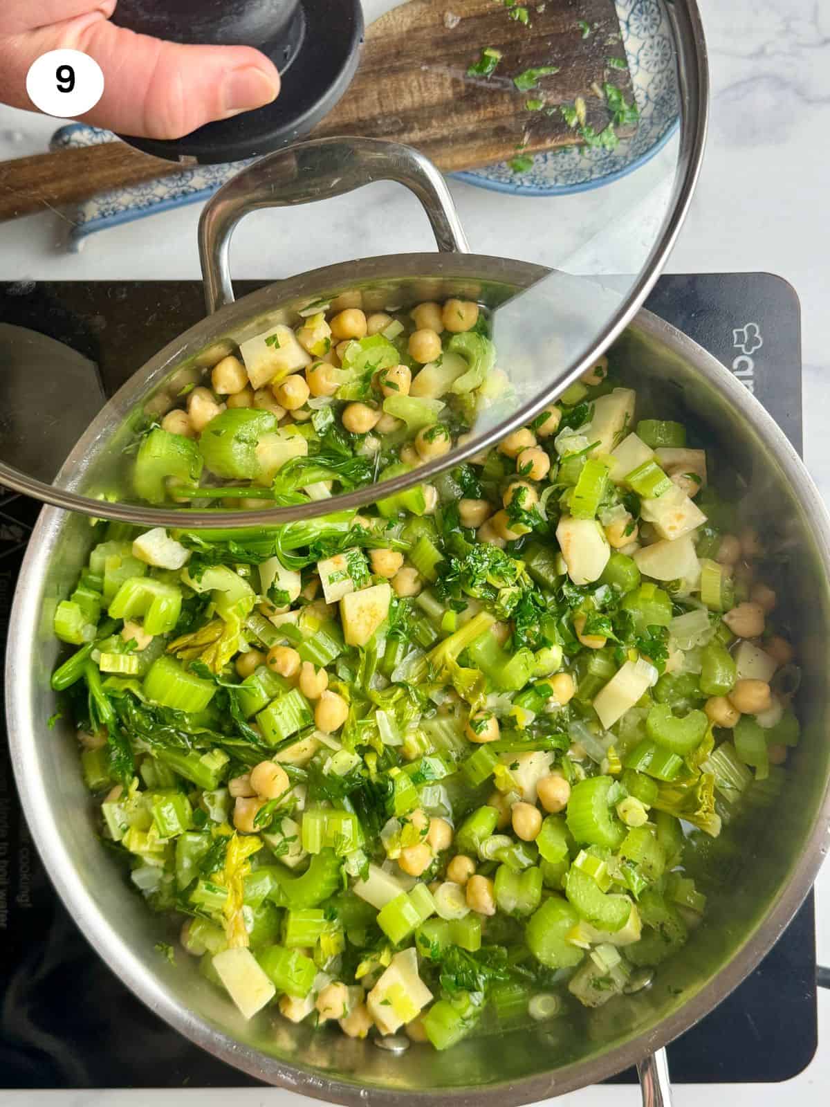 Added the chickpeas and herbs to the pot.