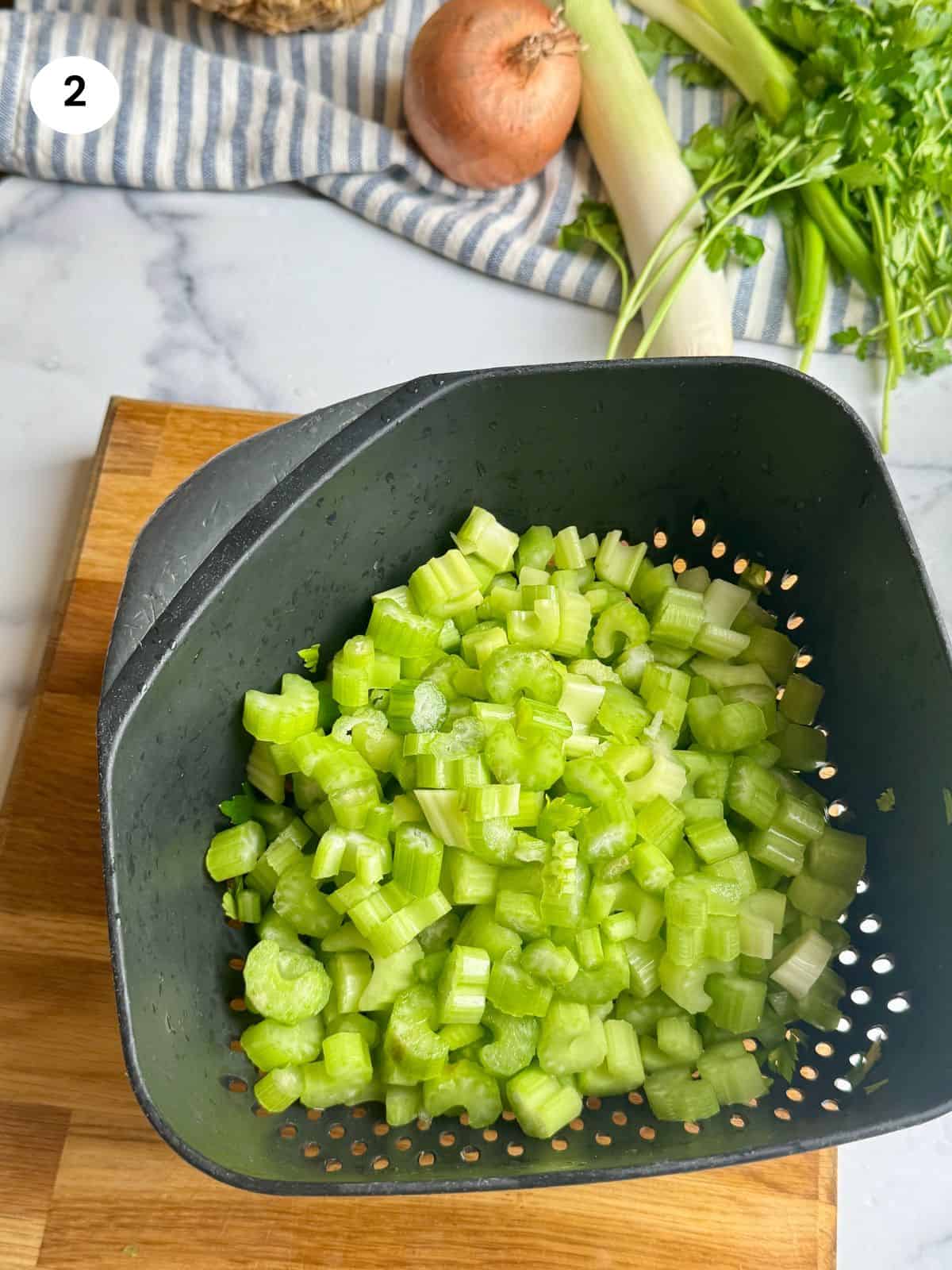 Cut celery stalks into smaller bits.