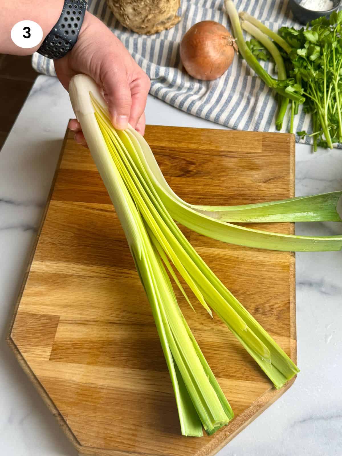 Leek cut in half lengthiwise and ready to be cleaned.