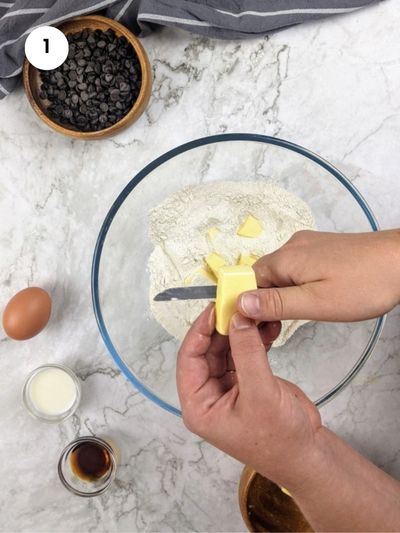 Adding the cold butter into the dry ingredients mix with my fingertips.