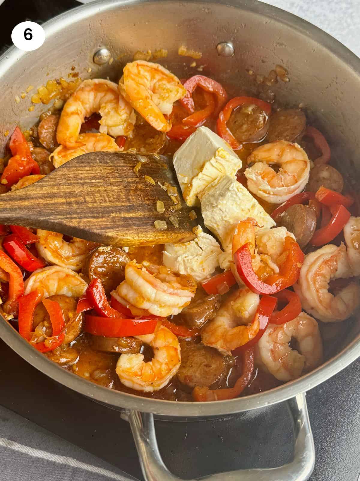 Adding the shrimps and creame cheese.