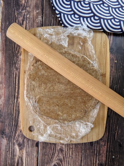 Rolling dough for coconut sugar cookies.