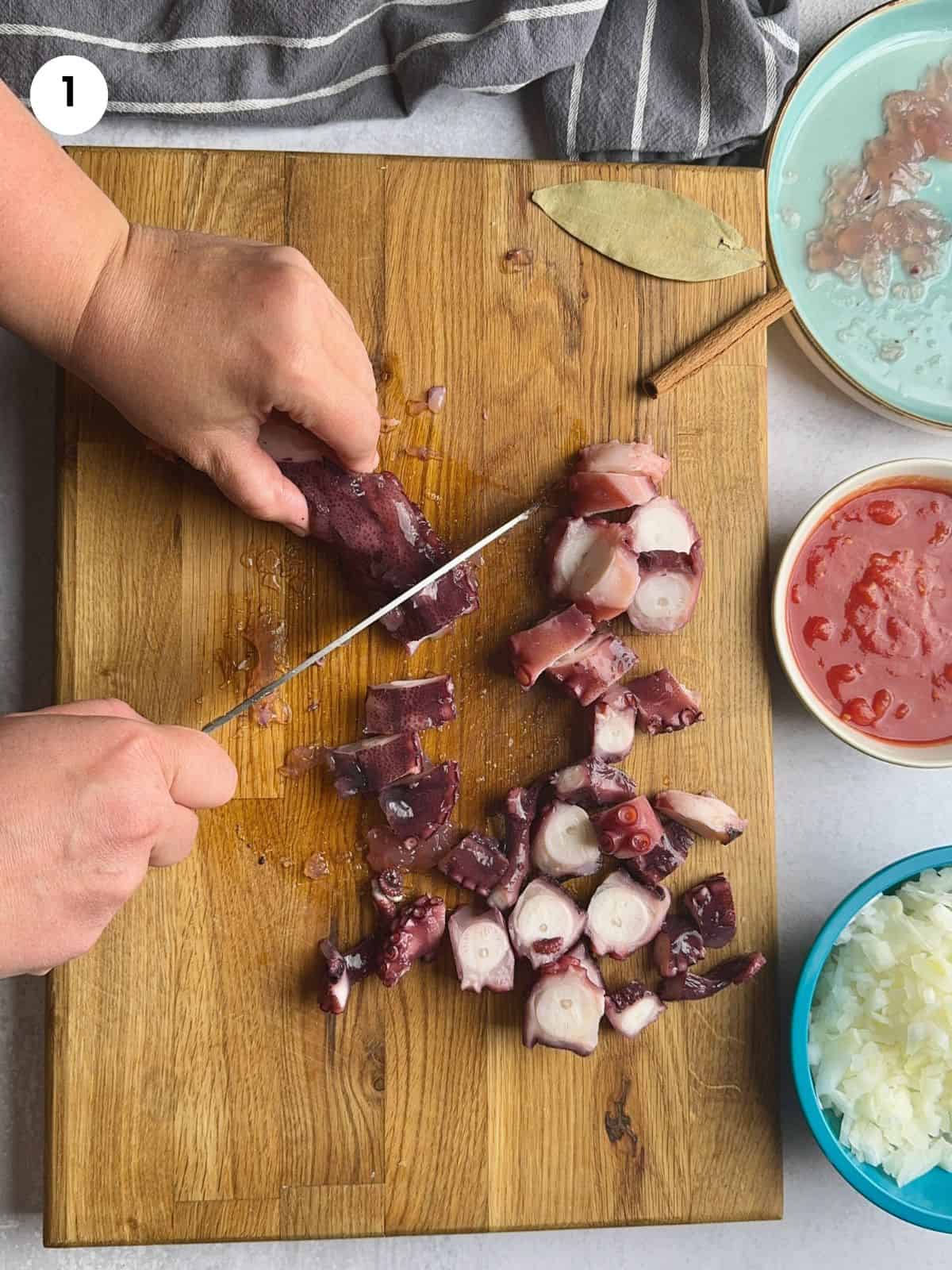 Chopping the octopus into chunks.