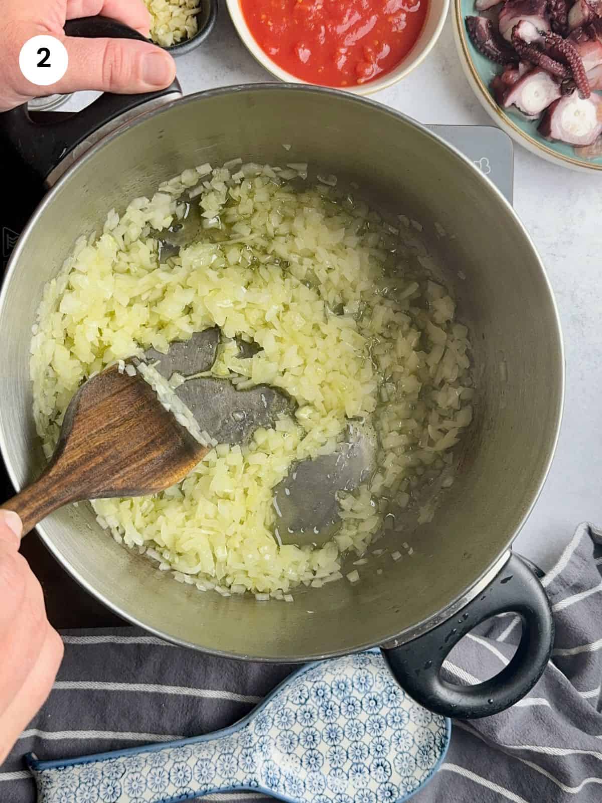 Sauteing the chopped onion.