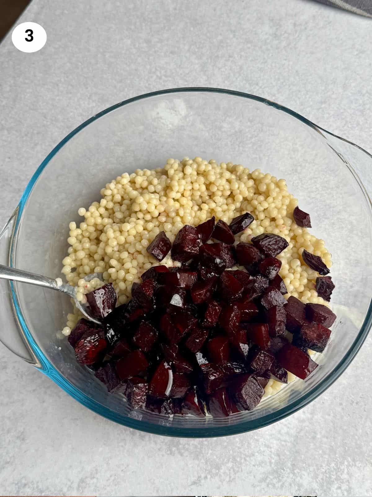Roasted beets and couscous in a bowl.
