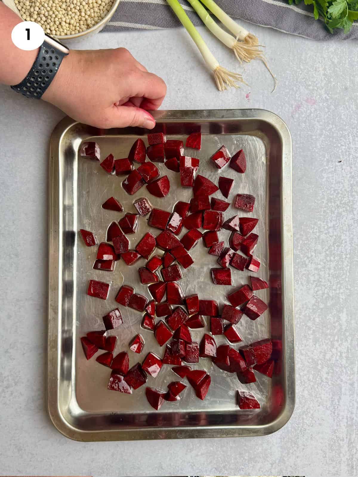 Diced beets on a baking tray.