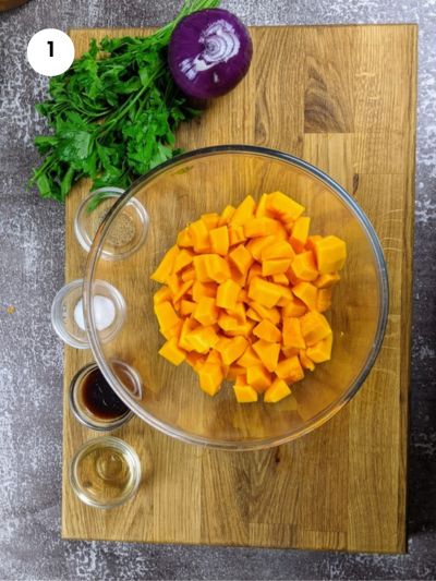 Cutting the squash into cubes.