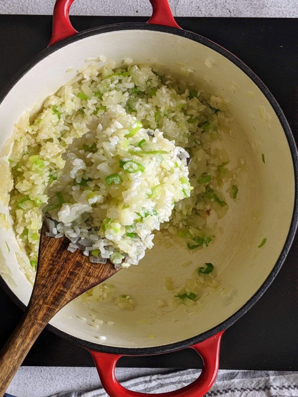 Onions and rice becoming more sticky and holding together.