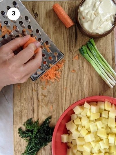 How to grate carrots for the potato salad.