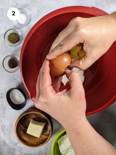 Adding the eggs to the bowl.