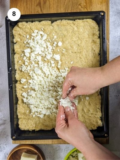 Crumbling the feta cheese