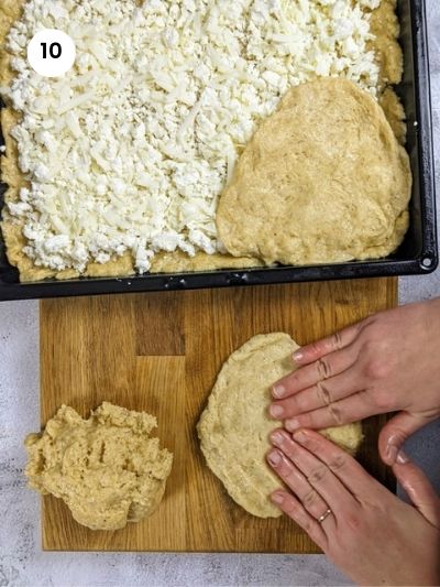 Adding the top layer of the feta bread.