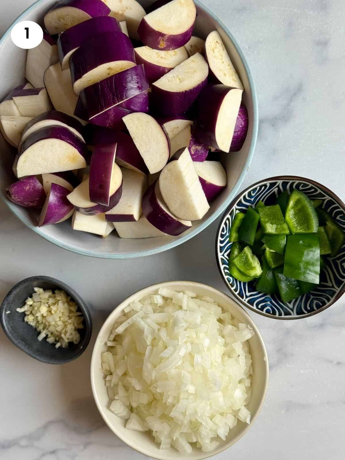 Chopped veggies in bowls.