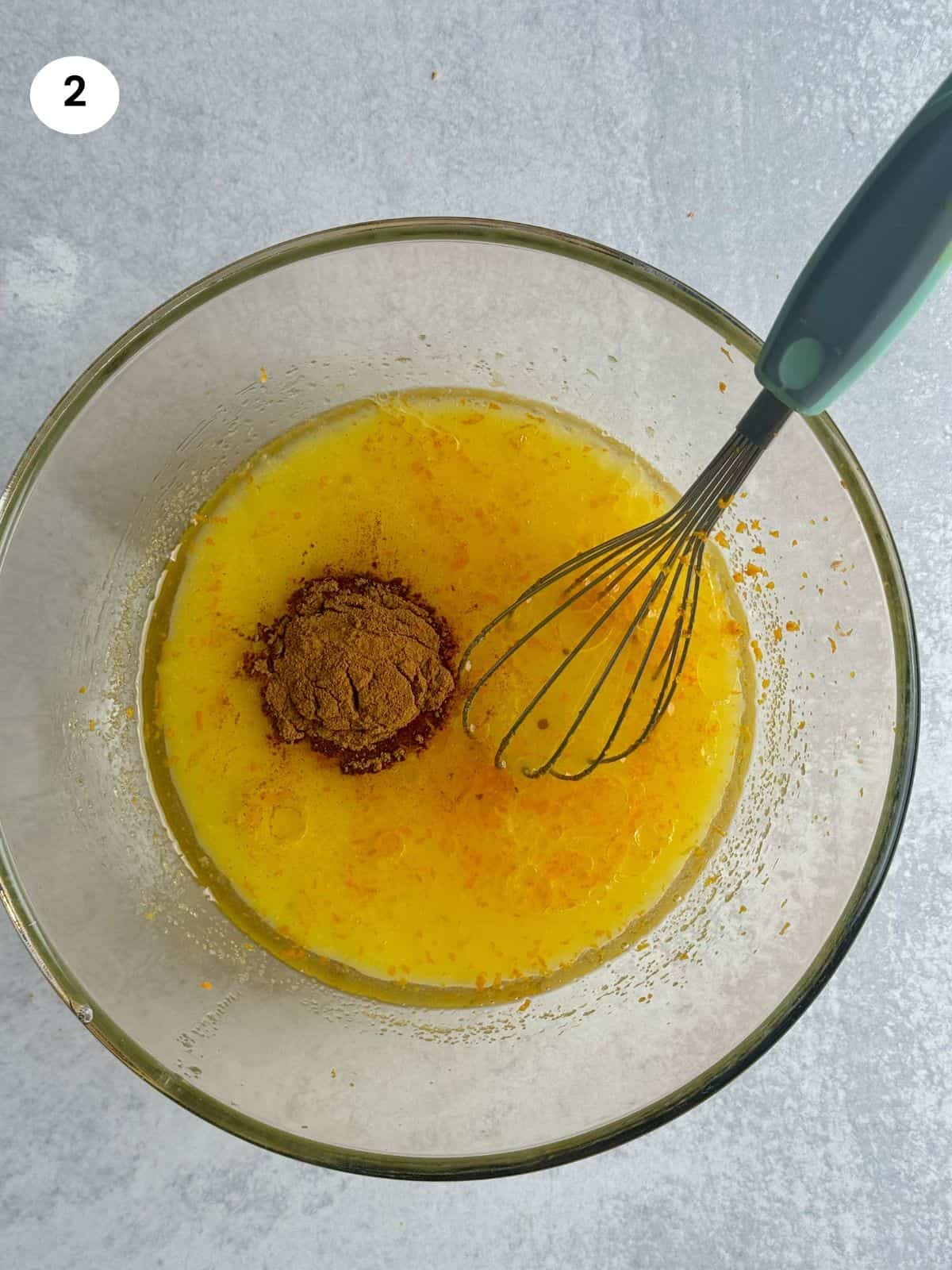 Added cinnamon and orange juice to the bowl.