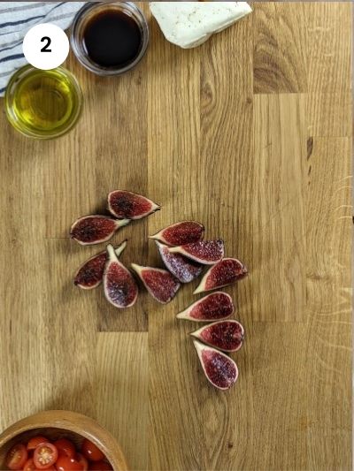Cutting the figs into four.