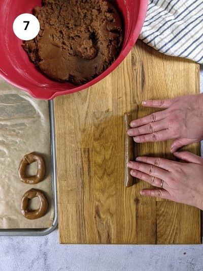 Rolling the dough into a long rope for shaping the cookies.