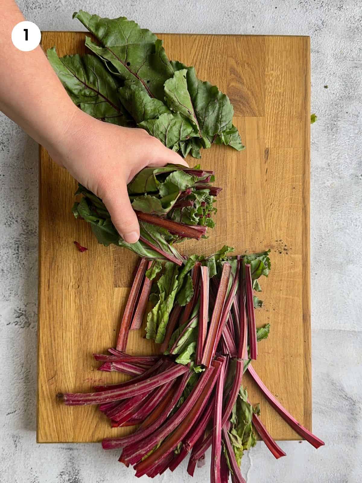 Cutting the beets leaves into smaller bits.